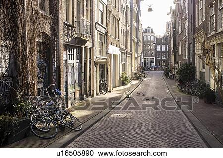 Bicycles parked on city sidewalk View Large Photo Image Stock Image - Bicycles parked on city sidewalk. Fotosearch