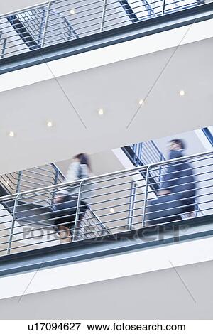 Blurred view of business people View Large Photo Image Stock Photo - Blurred view of business people. Fotosearch