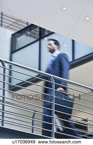 Blurred view of businessman on balcony View Large Photo Image Stock Photo - Blurred view of businessman on balcony. Fotosearch