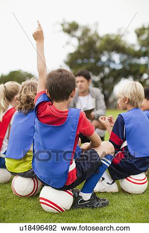Boy raising his hand during practice View Large Photo Image Stock Image - Boy raising his hand during practice. Fotosearch