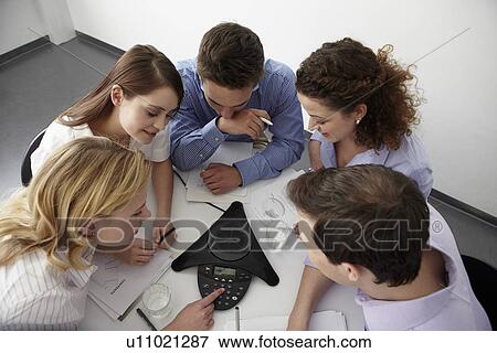 Business people in conference call View Large Photo Image Stock Photo - Business people in conference call. Fotosearch