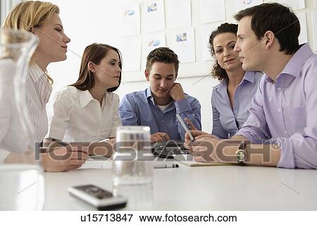 Business people in conference call View Large Photo Image Stock Photo - Business people in conference call. Fotosearch