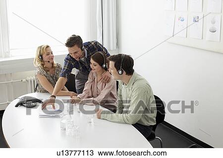 Business people in headsets in meeting View Large Photo Image Stock Image - Business people in headsets in meeting. Fotosearch