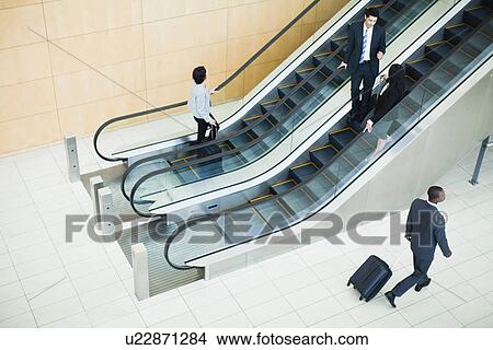 Business people in lobby area View Large Photo Image Picture - Business people in lobby area. Fotosearch