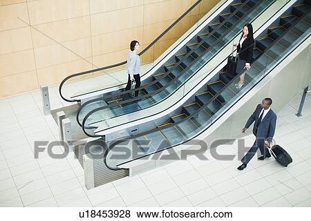 Business people in lobby area View Large Photo Image Stock Photo - Business people in lobby area. Fotosearch