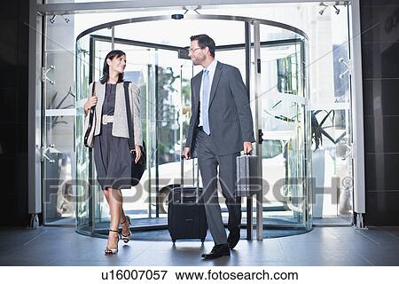 Business people in revolving door View Large Photo Image Stock Photo - Business people in revolving door. Fotosearch