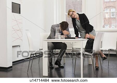 Business people laughing in office View Large Photo Image Picture - Business people laughing in office. Fotosearch