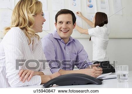 Business people laughing in office View Large Photo Image Stock Photo - Business people laughing in office. Fotosearch