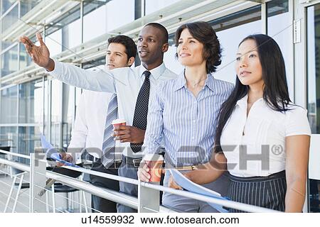 Business people on indoor balcony View Large Photo Image Stock Image - Business people on indoor balcony. Fotosearch
