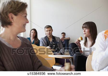 Business people relaxing in office View Large Photo Image Stock Photograph - Business people relaxing in office. Fotosearch