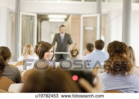 Business people sitting in seminar View Large Photo Image Stock Image - Business people sitting in seminar. Fotosearch