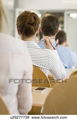 Business people sitting in seminar View Large Photo Image Stock Photo - Business people sitting in seminar. Fotosearch