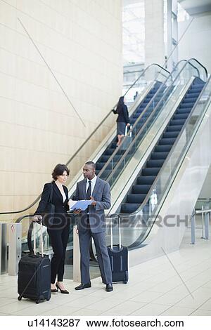 Business people talking in lobby View Large Photo Image Stock Photo - Business people talking in lobby. Fotosearch