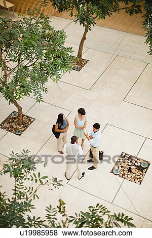 Business people talking in lobby View Large Photo Image Stock Photo - Business people talking in lobby. Fotosearch
