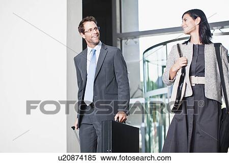 Business people walking in office View Large Photo Image Stock Photography - Business people walking in office. Fotosearch