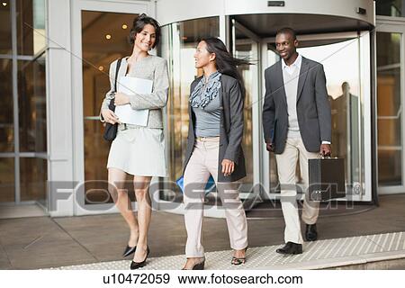 Stock Photo - Business people walking on steps. Fotosearch