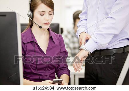 Picture - Business people working in headsets. Fotosearch
