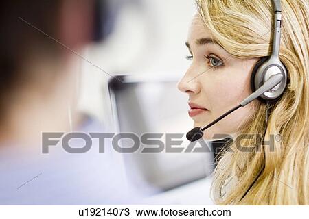 Business people working in headsets View Large Photo Image Stock Image - Business people working in headsets. Fotosearch