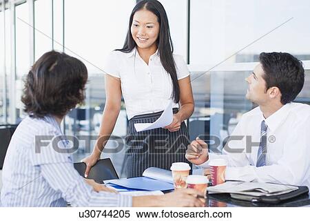 Business people working together in cafe View Large Photo Image Stock Photography - Business people working together in cafe. Fotosearch