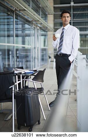 Businessman drinking coffee in cafe View Large Photo Image Stock Image - Businessman drinking coffee in cafe. Fotosearch