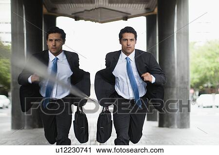 Businessman running on city street View Large Photo Image Stock Image - Businessman running on city street. Fotosearch