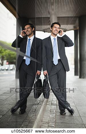 Businessman talking on cell phone View Large Photo Image Stock Photo - Businessman talking on cell phone. Fotosearch