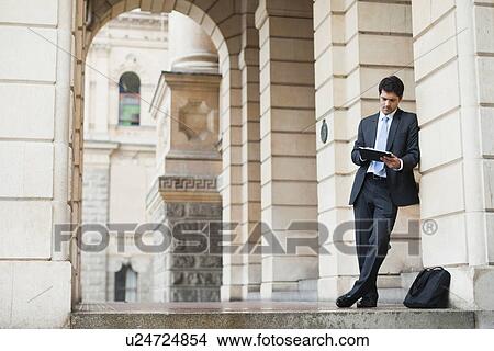 Businessman using tablet computer View Large Photo Image Picture - Businessman using tablet computer. Fotosearch