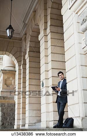 Businessman using tablet computer View Large Photo Image Stock Photograph - Businessman using tablet computer. Fotosearch