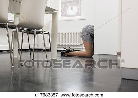 Stock Photo - Businesswoman crawling on office floor. Fotosearch