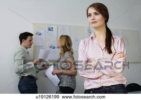 Stock Photo - Businesswoman standing in office. Fotosearch
