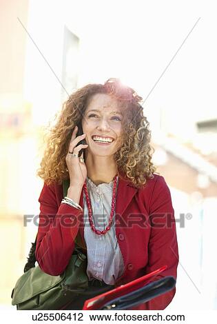 Businesswoman talking on cell phone View Large Photo Image Stock Image - Businesswoman talking on cell phone. Fotosearch