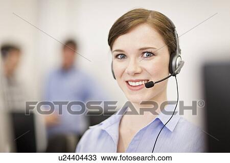 Businesswoman working in headset View Large Photo Image Stock Image - Businesswoman working in headset. Fotosearch