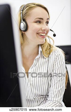 Businesswoman working in headset View Large Photo Image Stock Photography - Businesswoman working in headset. Fotosearch