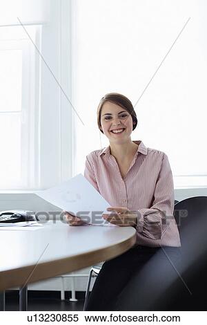 Businesswoman working in office View Large Photo Image Stock Photography - Businesswoman working in office. Fotosearch