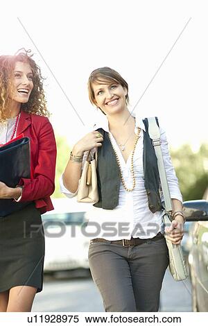 Businesswomen walking together View Large Photo Image Stock Photography - Businesswomen walking together. Fotosearch