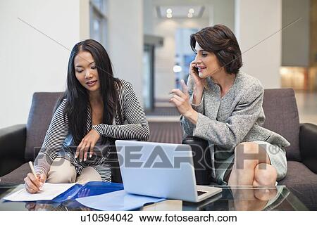 Businesswomen working together View Large Photo Image Stock Image - Businesswomen working together. Fotosearch