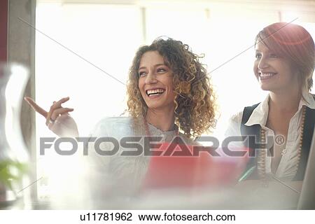 Businesswomen working together View Large Photo Image Stock Image - Businesswomen working together. Fotosearch