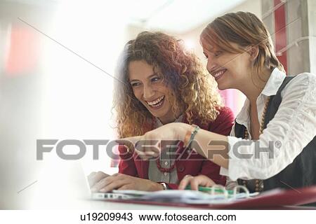Businesswomen working together View Large Photo Image Stock Image - Businesswomen working together. Fotosearch