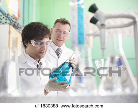 Stock Photo - Chemistry student working in lab. Fotosearch