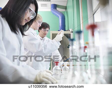 Chemistry students working in lab View Large Photo Image Stock Photograph - Chemistry students working in lab. Fotosearch