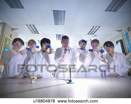 Stock Photo - Chemistry teacher and students in lab. Fotosearch