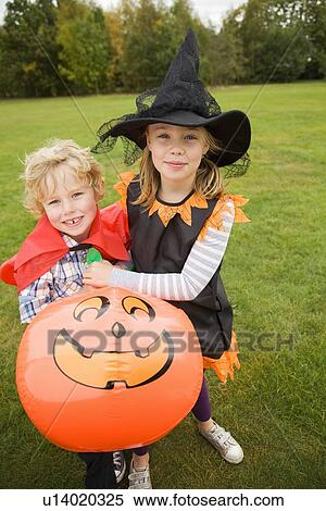 Children wearing Halloween costumes View Large Photo Image Stock Photography - Children wearing Halloween costumes. Fotosearch