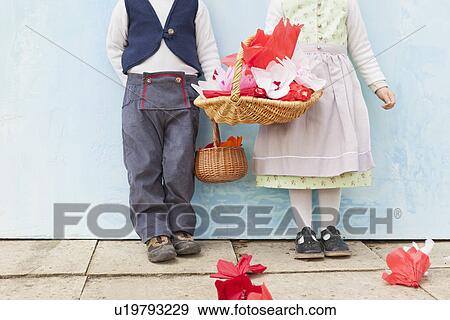 Stock Photo - Children with baskets of paper flowers. Fotosearch