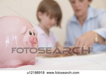 Stock Photo - Close up of childs piggy bank. Fotosearch