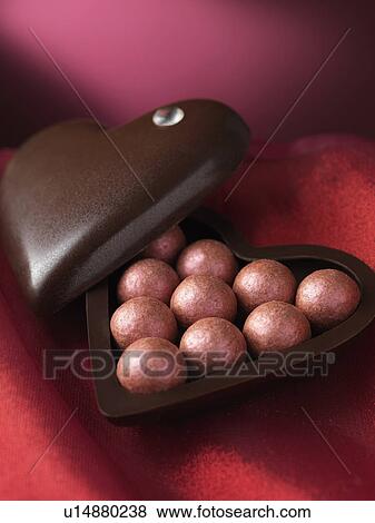 Close up of chocolates in decorative box View Large Photo Image Stock Photo - Close up of chocolates in decorative box. Fotosearch