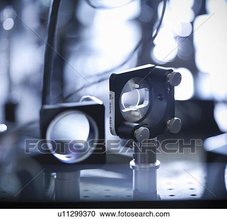 Stock Image - Close up of laser mirrors in lab. Fotosearch
