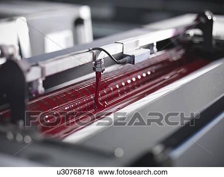 Close up of red ink in printing press View Large Photo Image Stock Photo - Close up of red ink in printing press. Fotosearch