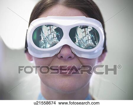Close up of scientist wearing goggles View Large Photo Image Picture - Close up of scientist wearing goggles. Fotosearch