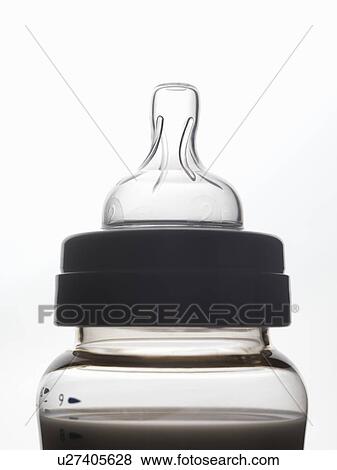 Close up of silhouette of baby bottle View Large Photo Image Stock Photo - Close up of silhouette of baby bottle. Fotosearch