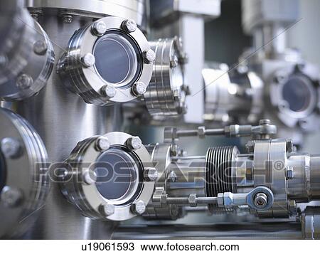 Stock Image - Close up of vacuum chamber in lab. Fotosearch